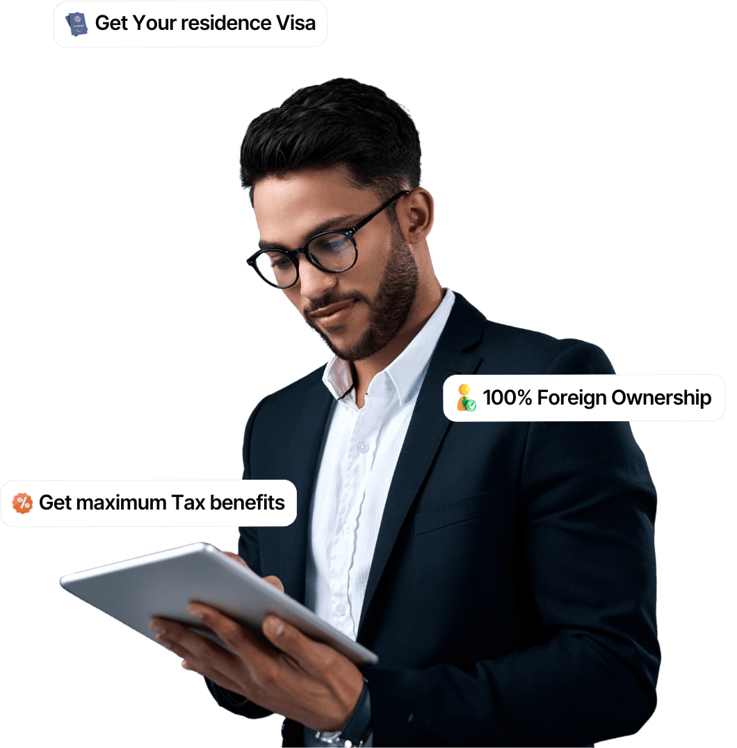 Entrepreneur managing an international business with residence visa benefits, 100% foreign ownership, and tax advantages.